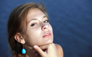 Woman blue earring looking up 2 - facial feature free wallpaper