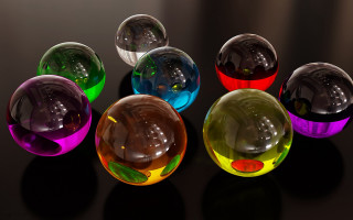 Colorful glass balls raytraced stilllife - top of a table next free wallpaper