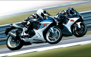 Motorcycles track grass field fenced - a fence free wallpaper
