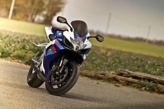 Blue motorcycle parked road field - the side of a road next free wallpaper
