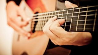Guitar hands strings foreground background - a person playing free wallpaper