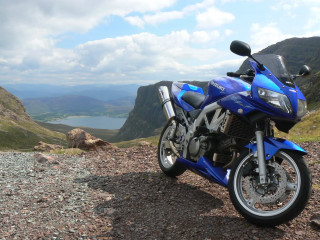 Blue motorcycle lake hill mountains - a blue motorcycle free wallpaper