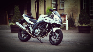 White motorcycle parked street building - the side of the road free wallpaper