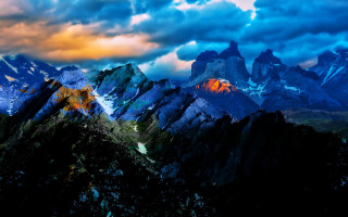 Mountain range cloudy sky city - a cloudy sky in the background free wallpaper