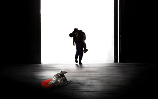 Person walking dark room backpack - toyism free wallpaper