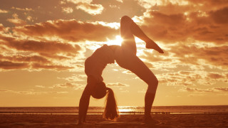 Woman beach sunset symmetry lighthouse - a handstand free wallpaper