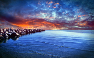 Rocks beach sunset cloudy sky - top of a beach under a cloudy sky free wallpaper