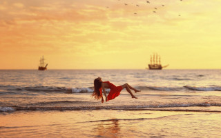 Woman red dress beach sunset 3 - overhead free wallpaper