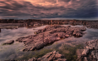 Rocky shore mountain lake city - rich moody colour free wallpaper