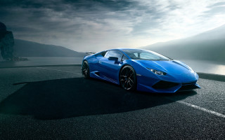 Blue sports car mountains ocean - a blue sports car free wallpaper for desktop