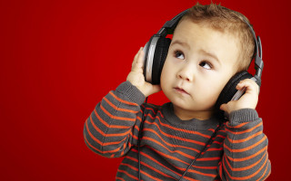 Young boy headphones listening music - music free wallpaper