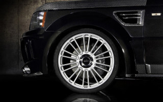 Black car chrome rim reflection - a black car free wallpaper
