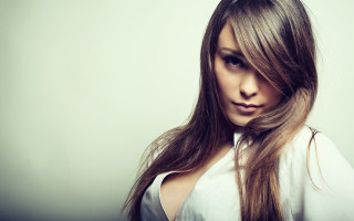 Woman longhair white shirt american - a white background behind her free wallpaper