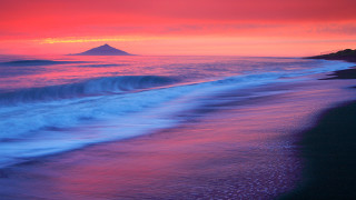 Beach wave mountain sunset mystical - a mountain in the distance free wallpaper