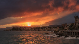 Sunset city water mountain skyline - a sunset over a city free wallpaper