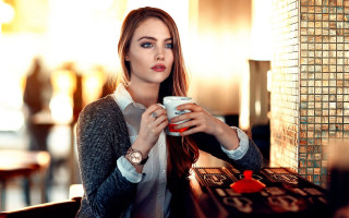 Woman coffee brick tiled de - a brick wall behind her free wallpaper