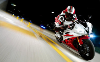 Motorcycle rider city street night - behind them free wallpaper