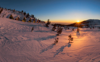 Sunset snowy mountain tents trees - a sunset over a snowy mountain free wallpaper
