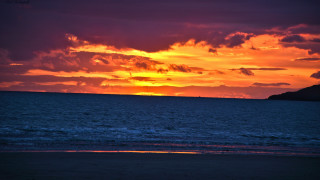 Sunset ocean boat mountain clouds 2 - vibrant colour free wallpaper