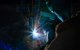 Welder metal lighting cityscape fireworks - a person in the background free wallpaper