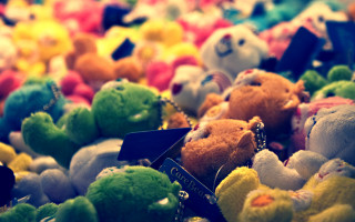 Stuffed animals table top bokeh - toyism free wallpaper