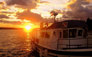 Sunset boat water horizon clouds - the sun setting behind free wallpaper