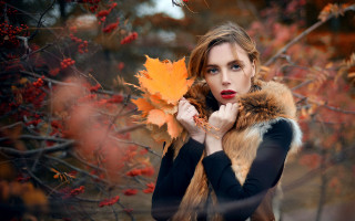 Woman holding leaf autumn fire - andor basch free wallpaper