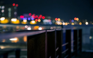 City skyline night fence bokeh - a city skyline free wallpaper