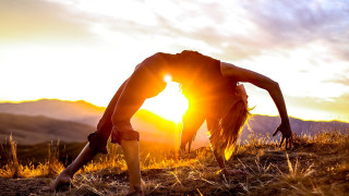 Woman grass sunset abstract sculpture - the sun setting behind her free wallpaper