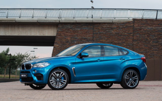 Blue bmw suv bridge brickwall - a brick wall behind free wallpaper