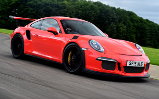 Red porsche sports car driving - the background and a sky background free wallpaper