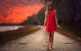 Woman red dress sunset outstretched - a dirt road free wallpaper