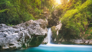 Waterfall blue water forest sunbeam - a waterfall in a forest free wallpaper