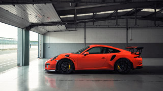 Bright orange porsche garage jigsaw - a large window free wallpaper