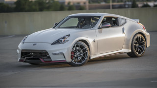 White sports car parking lot 6 - a building in the background free wallpaper