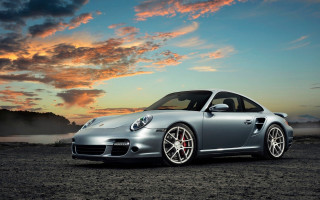 Silver sports car sunset dirt - the background and a body of water free wallpaper