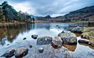Lake rocks bench mountains clouds - andrew geddes free wallpaper