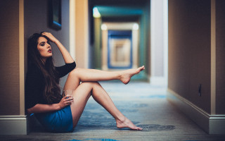 Woman sitting hallway crossed leg - annabel eyres free wallpaper