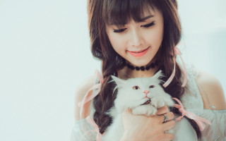Woman holding white cat smiling 2 - a white cat free wallpaper