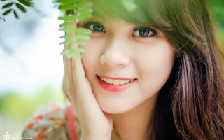 Woman blue eyes green leaf 2 - a green plant free wallpaper