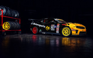 Yellow car tires dark room - a yellow car free wallpaper