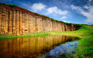 Rock wall water grass sky - the side of it free wallpaper for desktop