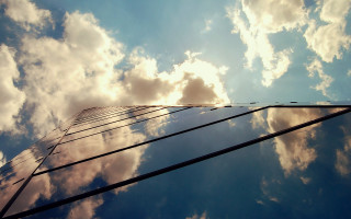 Tall building clouds sky cityscape - a tall building free wallpaper