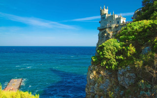 Castle cliff ocean pier blue - a castle free wallpaper