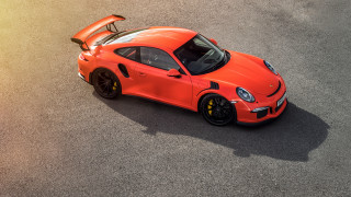 Bright orange sports car hood - its hood open free wallpaper