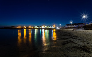 Night beach pier lights reflection - a pier free wallpaper