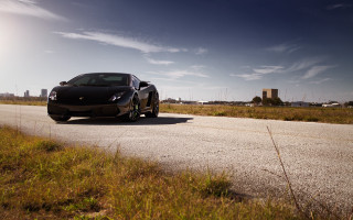 Black sports car road field - a road next free wallpaper