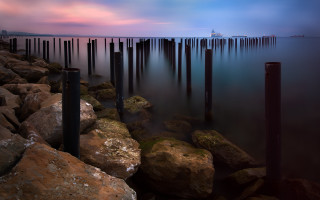 Long dock rocks poles boat - a long dock free wallpaper