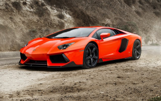 Bright orange sports car cliff - matte finish free wallpaper