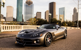 Sports car city skyline matte - the side of the road in front free wallpaper
